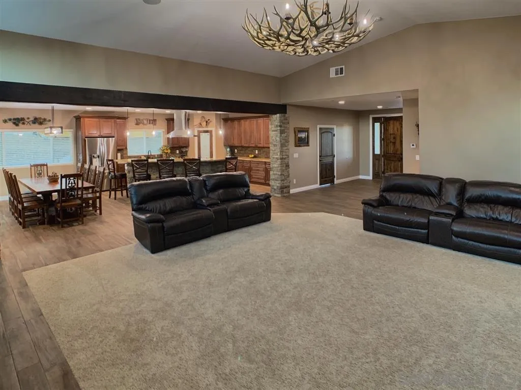 14117 Proctor Valley Road Jamul, CA 91935 - Photo 5 of 25 a living room with furniture and a large window