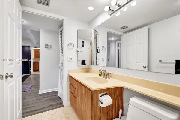a bathroom with a sink double vanity and a shower