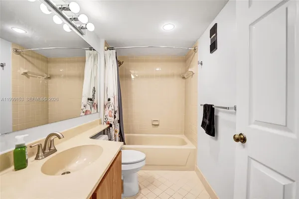 a bathroom with a sink toilet bathtub and shower