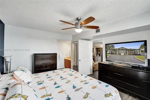 a bedroom with a bed and a dresser