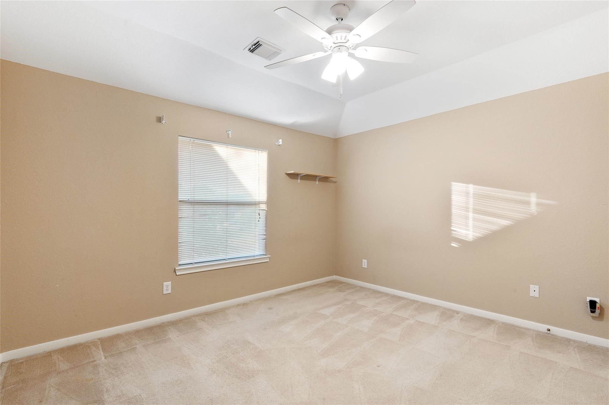 4302 Country Oaks Court Spring, TX 77388 - Photo 20 of 25 an empty room with windows and fan