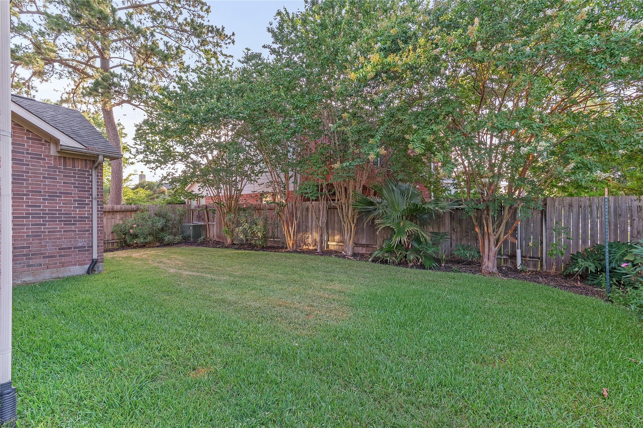 4302 Country Oaks Court Spring, TX 77388 - Photo 25 of 25 a backyard of a house with lots of green space