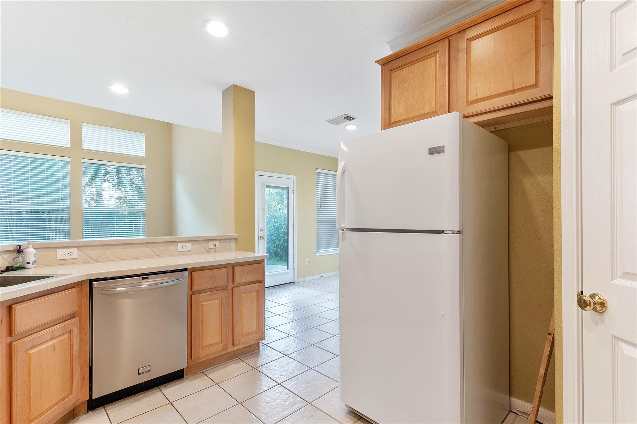 4302 Country Oaks Court Spring, TX 77388 - Photo 9 of 25 a kitchen with a refrigerator and a sink