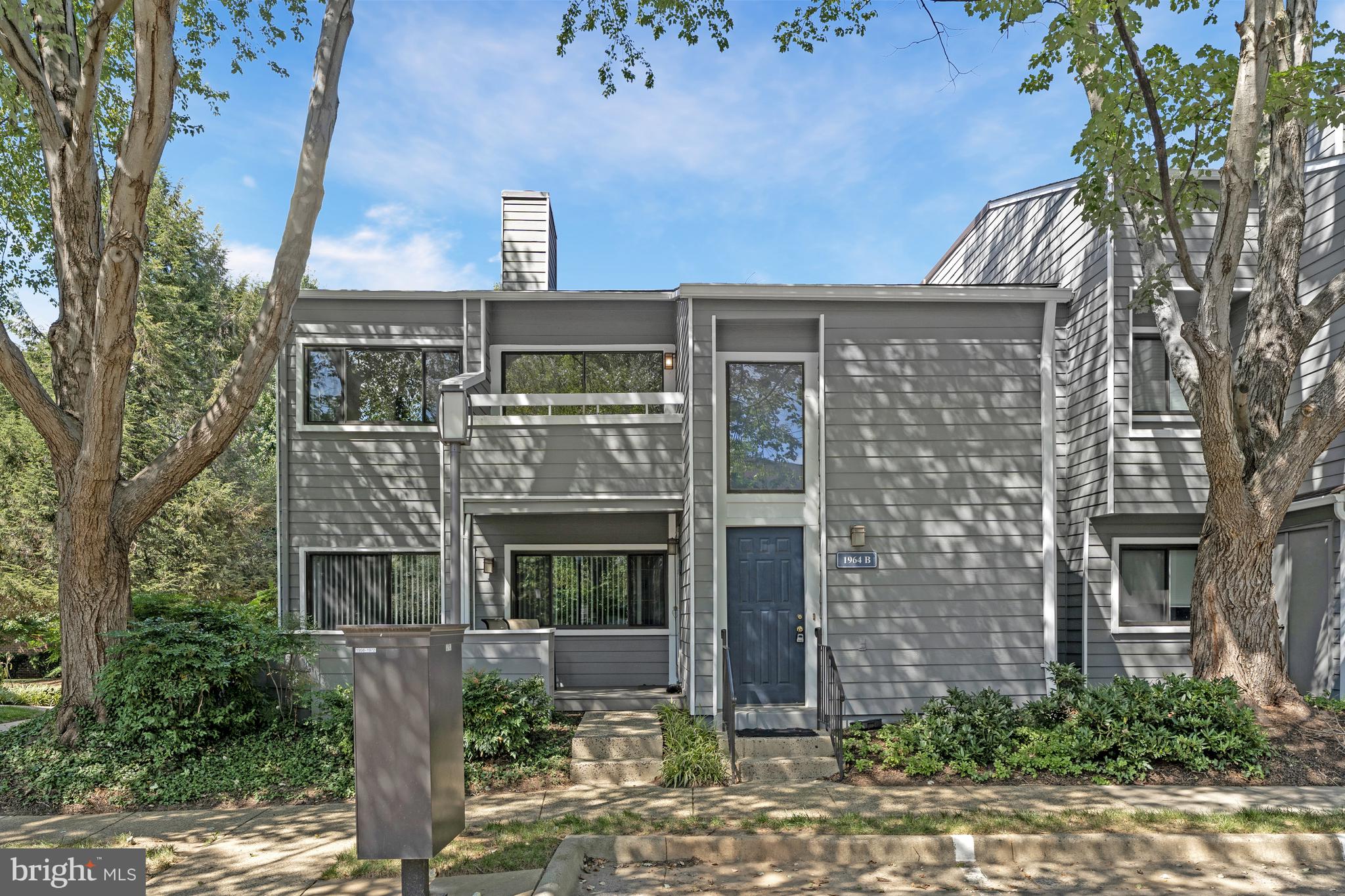 1964 Villaridge Drive Reston, VA 20191 - Photo 1 of 27 a front view of a house with a garden