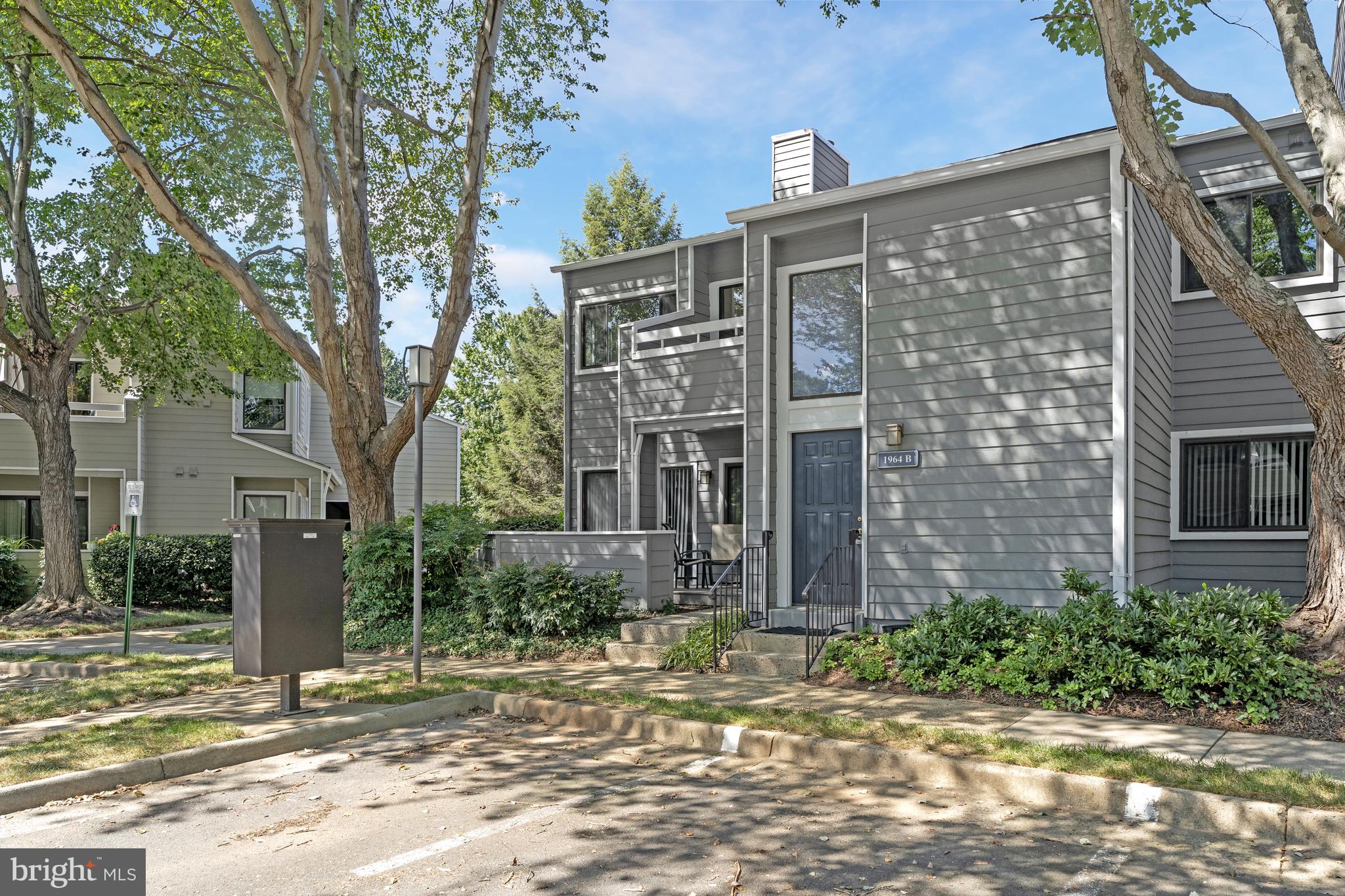 1964 Villaridge Drive Reston, VA 20191 - Photo 2 of 27 a view of a brick building next to a yard