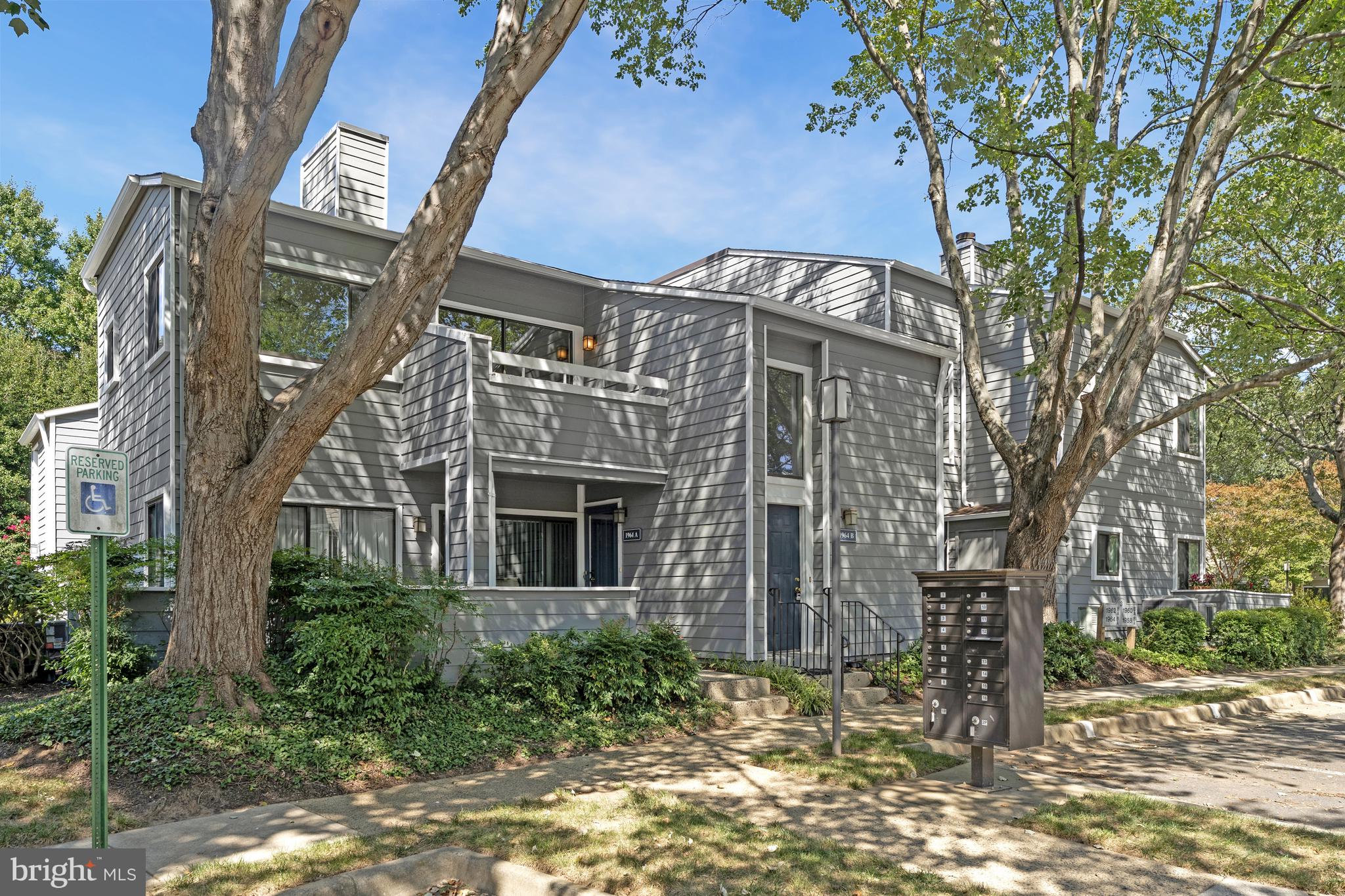 1964 Villaridge Drive Reston, VA 20191 - Photo 3 of 27 a front view of a house with a garden