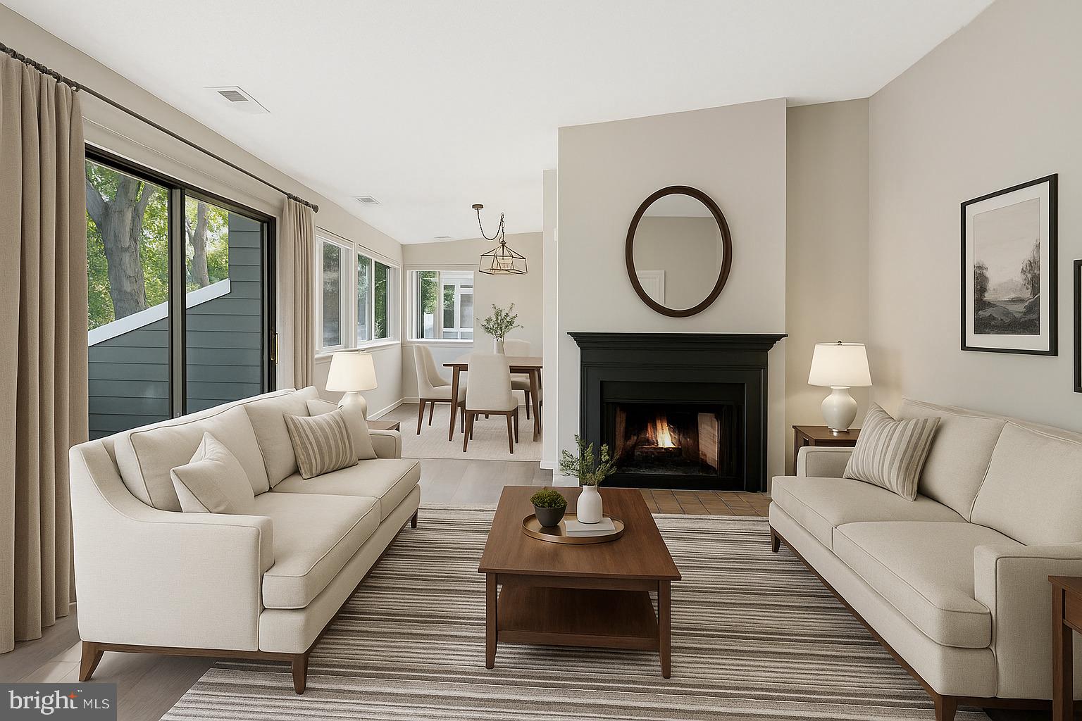 1964 Villaridge Drive Reston, VA 20191 - Photo 8 of 27 a living room with furniture a rug a fireplace and a large window