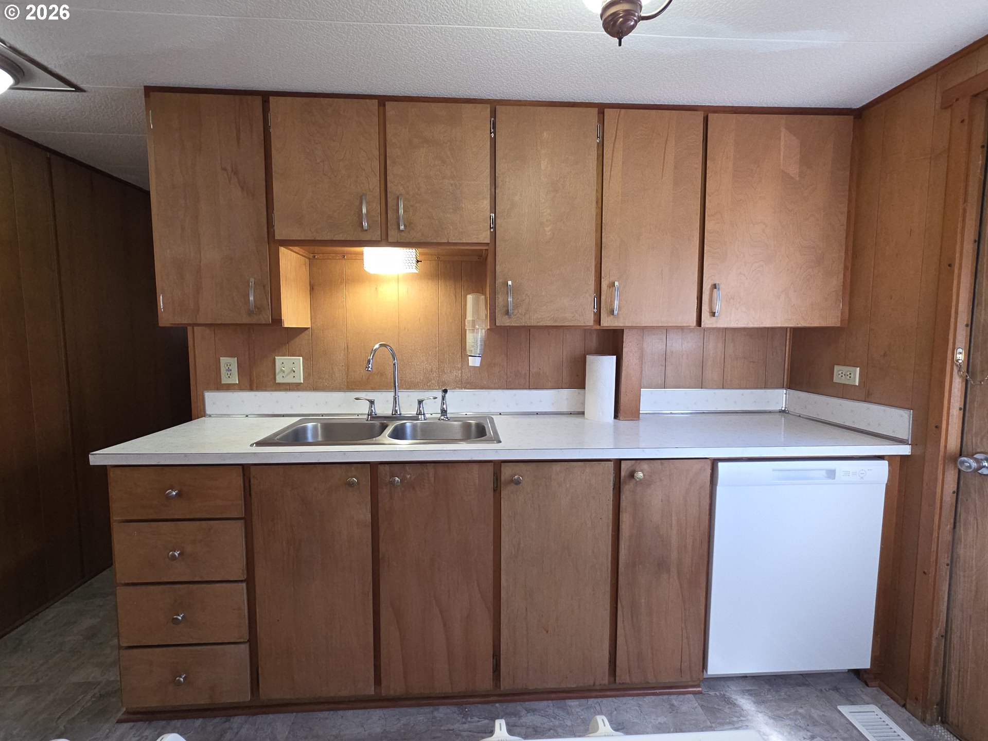 3203 Southeast Vineyard Road, Unit 44 Milwaukie, OR 97267 - Photo 17 of 38 a kitchen with a sink a cabinets and window