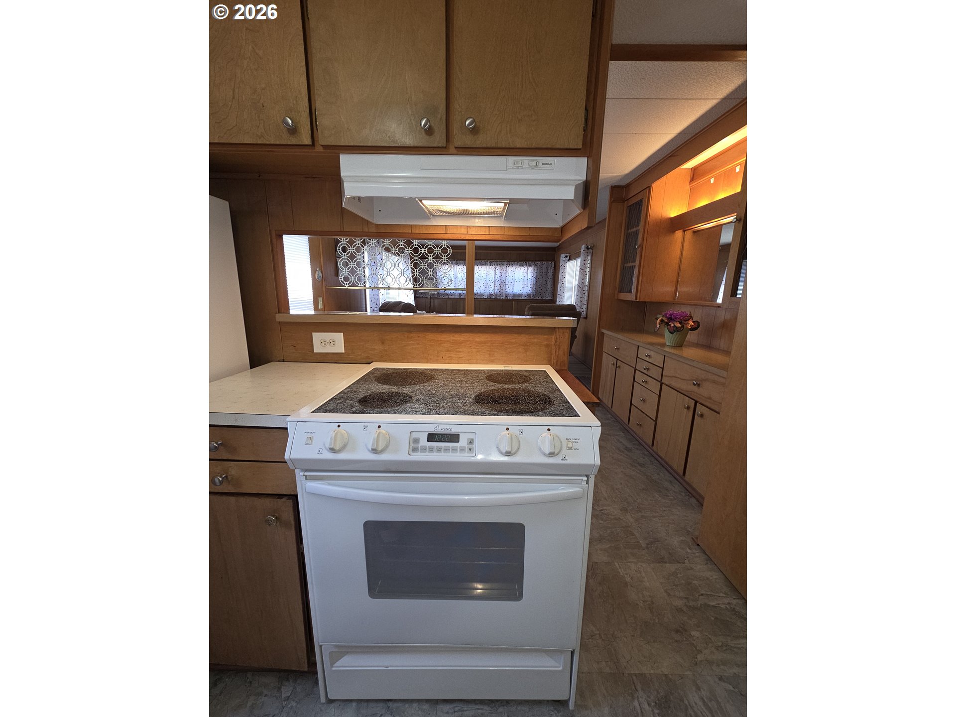 3203 Southeast Vineyard Road, Unit 44 Milwaukie, OR 97267 - Photo 18 of 38 a stove top oven sitting inside of a kitchen