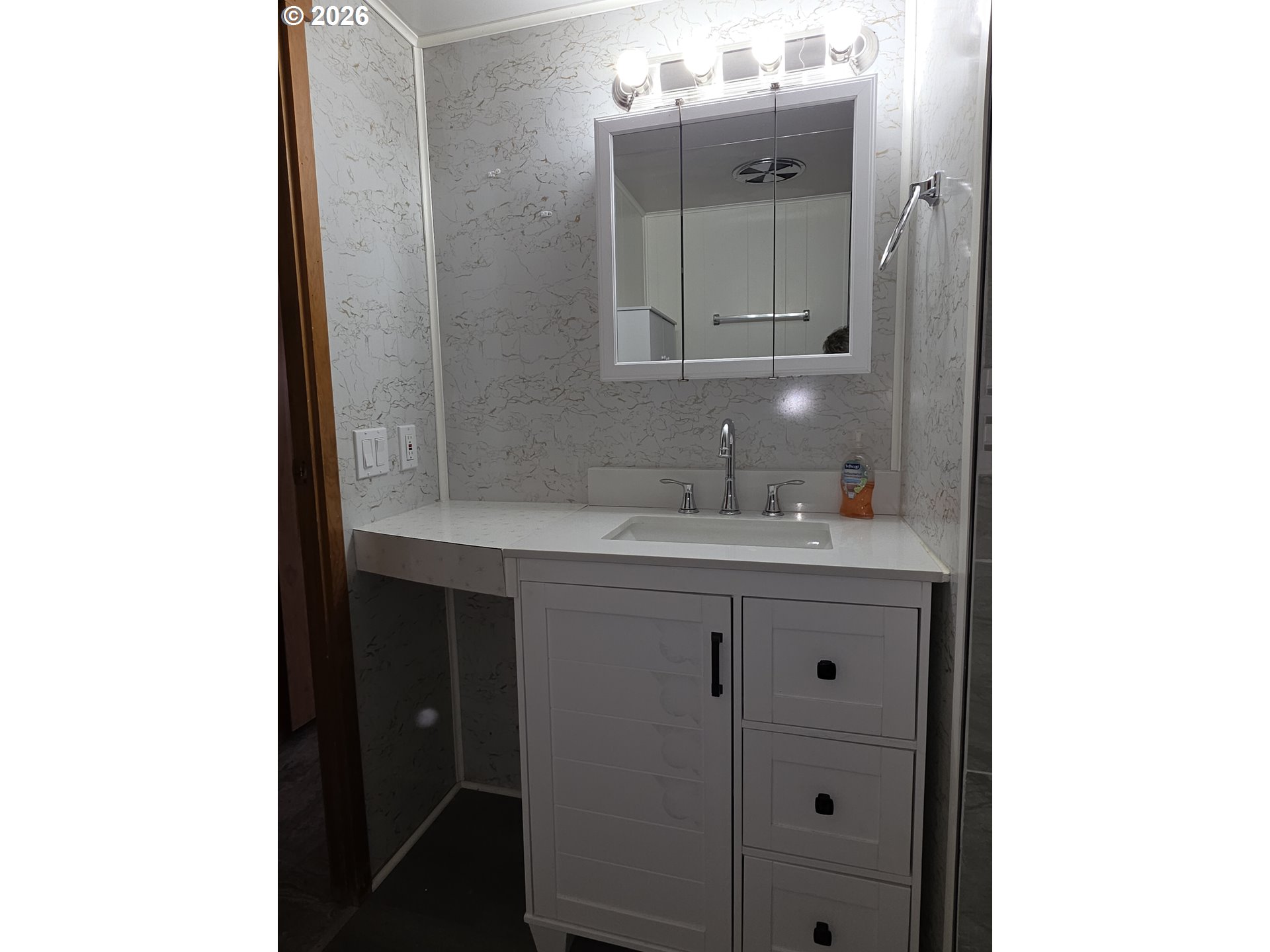 3203 Southeast Vineyard Road, Unit 44 Milwaukie, OR 97267 - Photo 20 of 38 a bathroom with a sink and a mirror