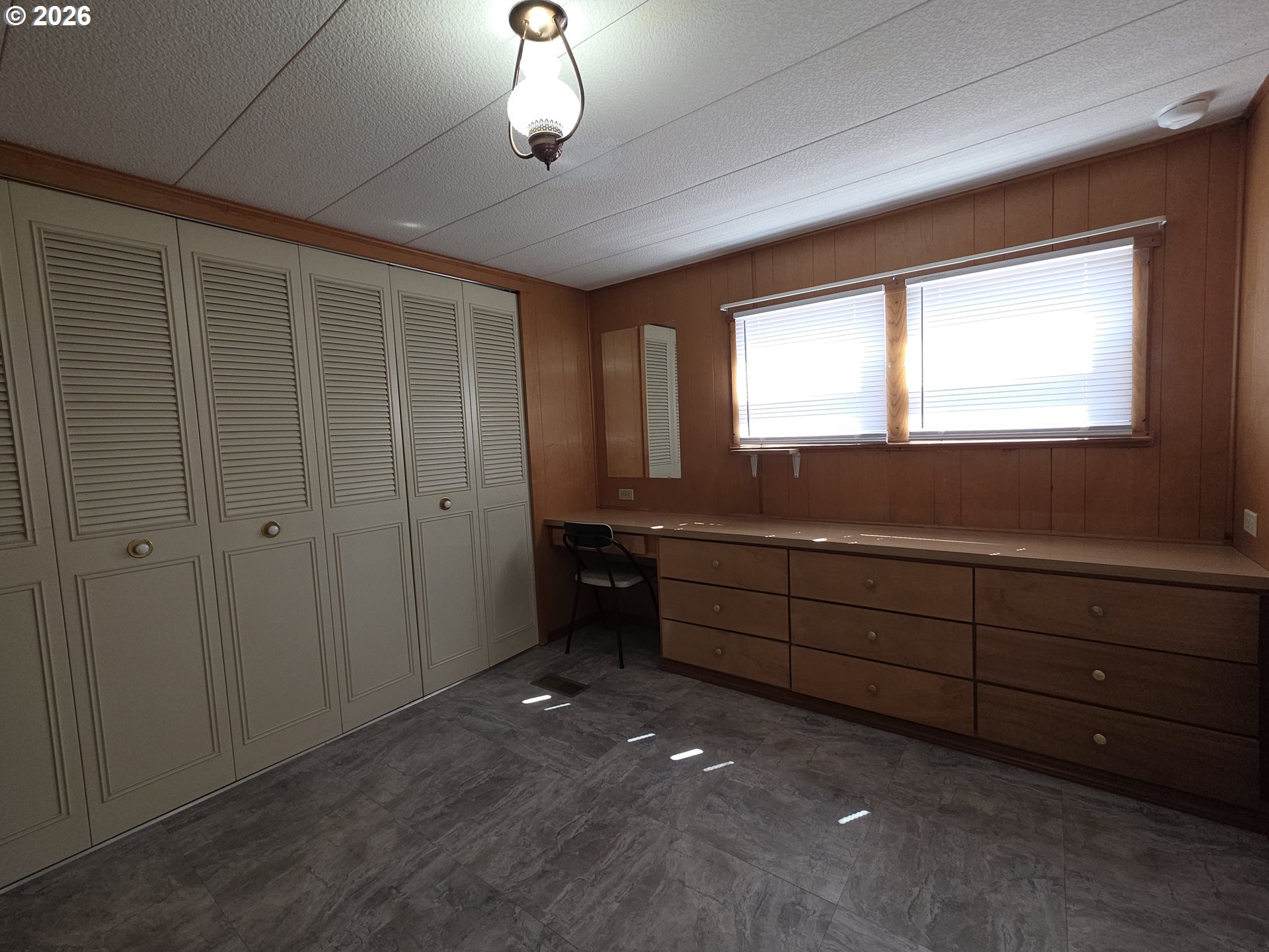 3203 Southeast Vineyard Road, Unit 44 Milwaukie, OR 97267 - Photo 23 of 38 a room with window and cabinet