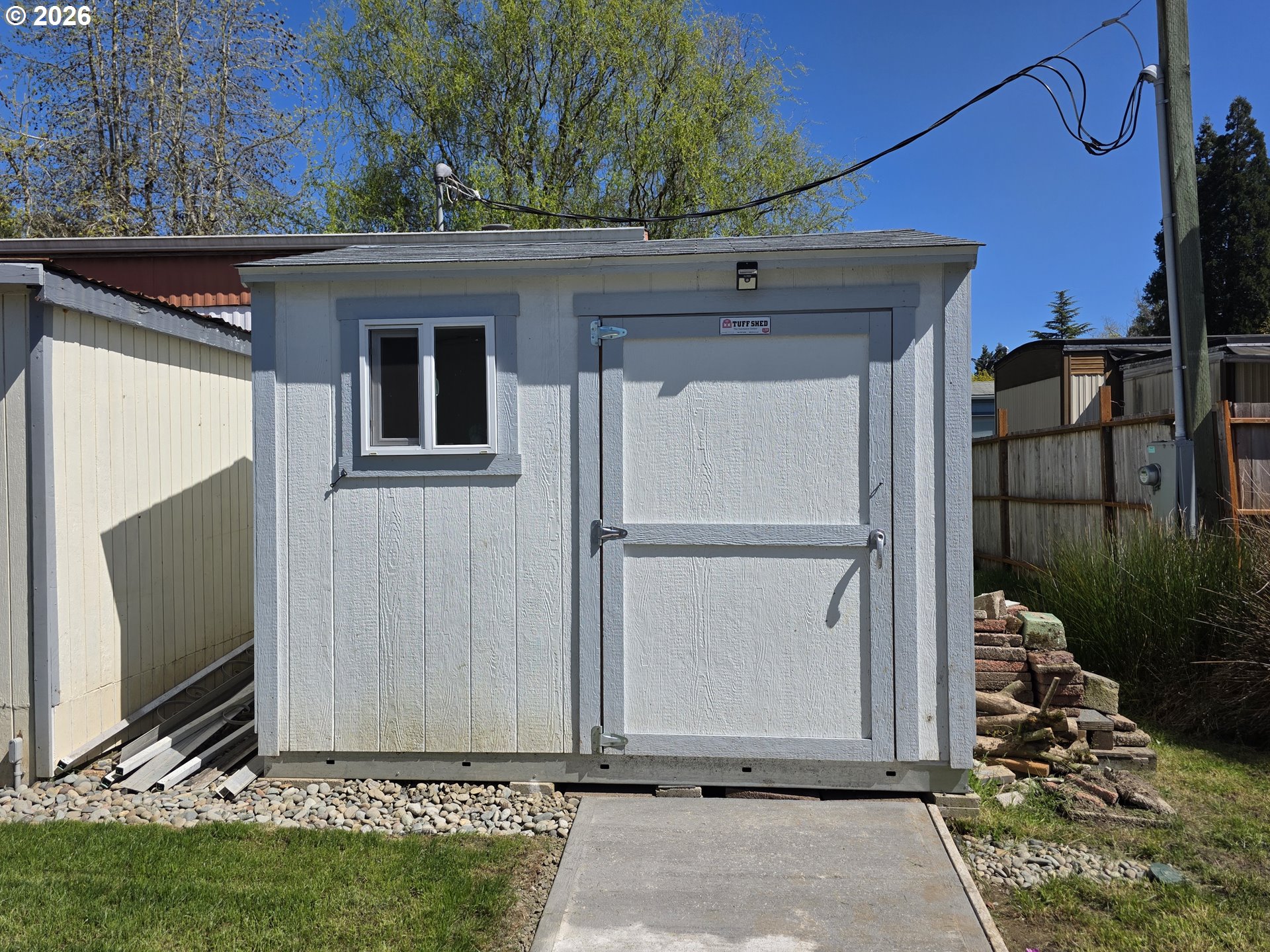 3203 Southeast Vineyard Road, Unit 44 Milwaukie, OR 97267 - Photo 5 of 38 a view of a front door and small yard