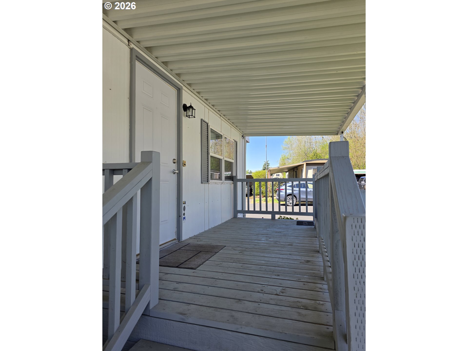 3203 Southeast Vineyard Road, Unit 44 Milwaukie, OR 97267 - Photo 6 of 38 a view of a hallway with wooden floor