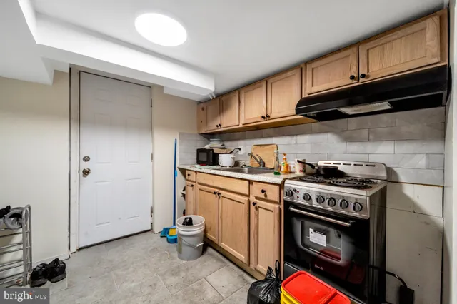 a kitchen with stainless steel appliances granite countertop a stove and a refrigerator