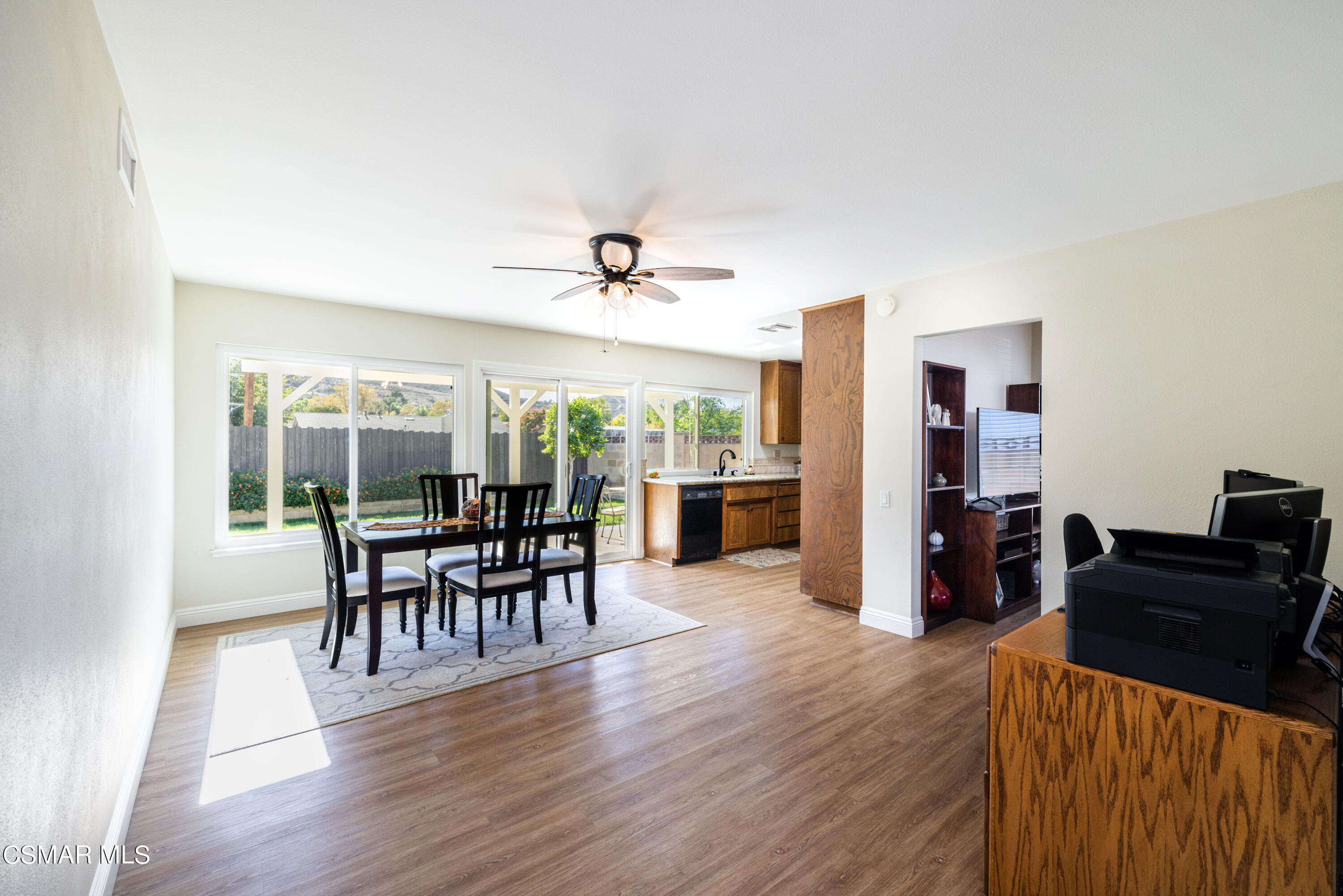 5708 Damon Street Simi Valley, CA 93063 - Photo 13 of 26 a view of a dining room with furniture and wooden floor