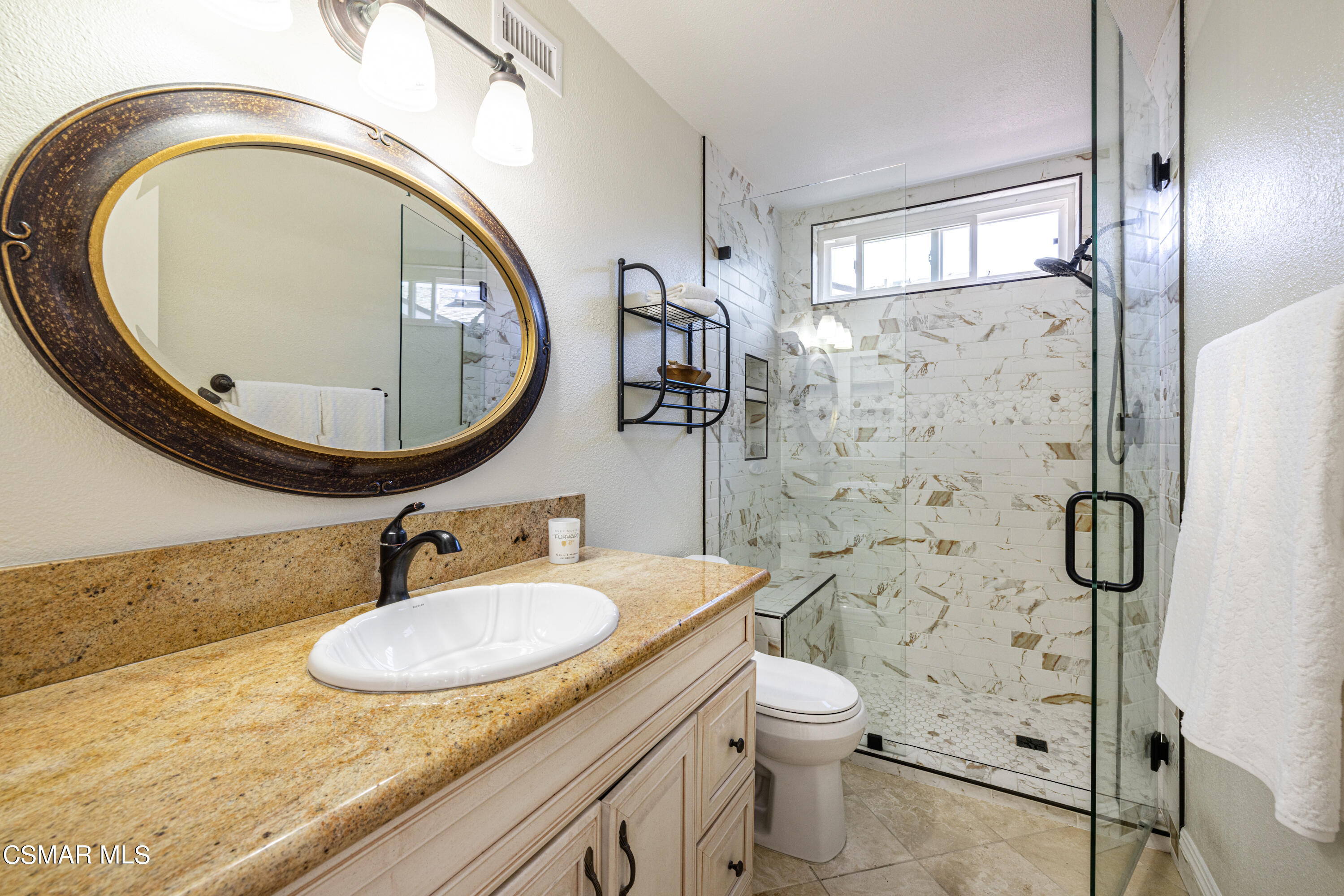 5708 Damon Street Simi Valley, CA 93063 - Photo 17 of 26 a bathroom with a sink and a mirror