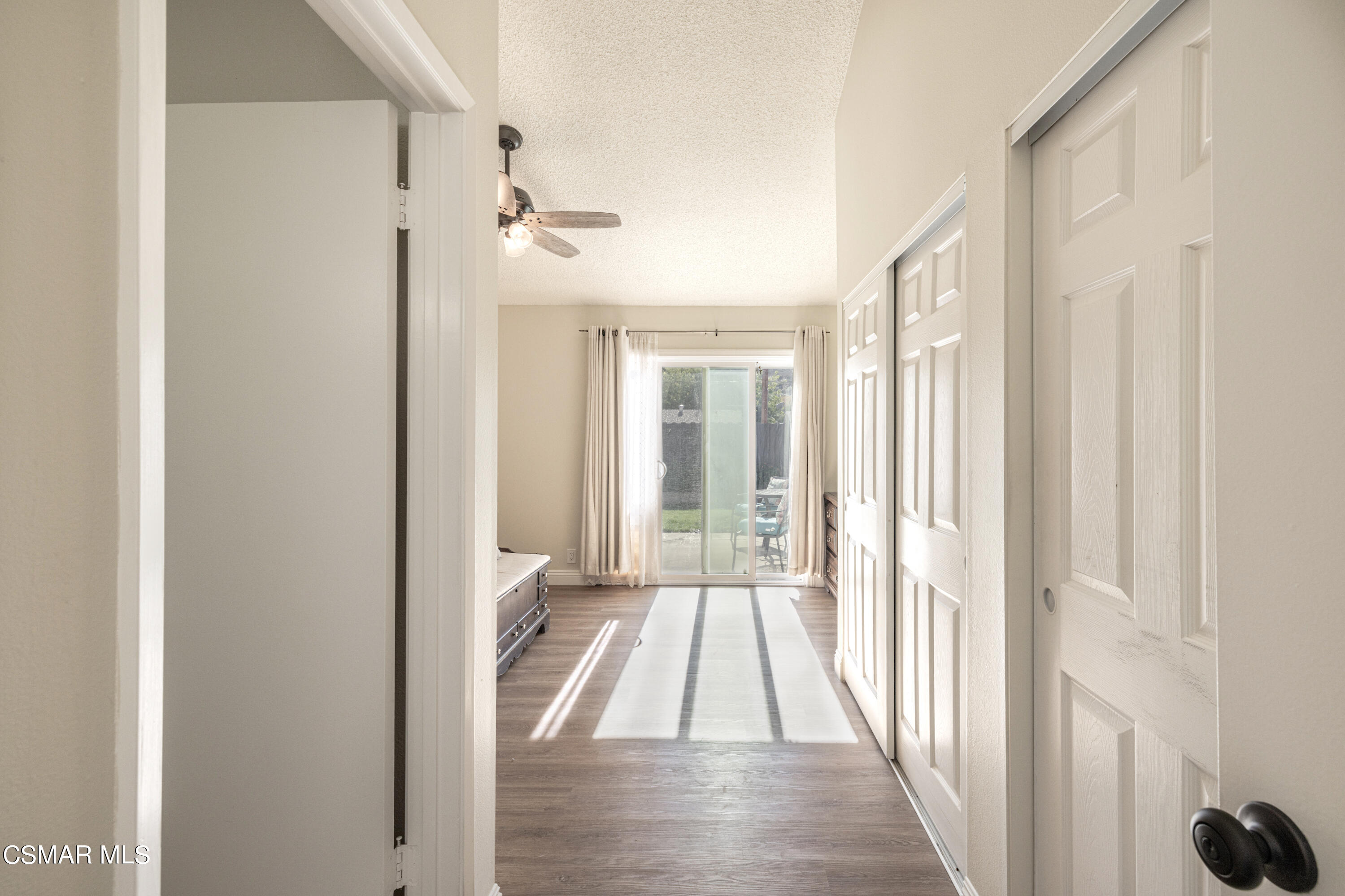 5708 Damon Street Simi Valley, CA 93063 - Photo 18 of 26 a view of a hallway with wooden floor and staircase