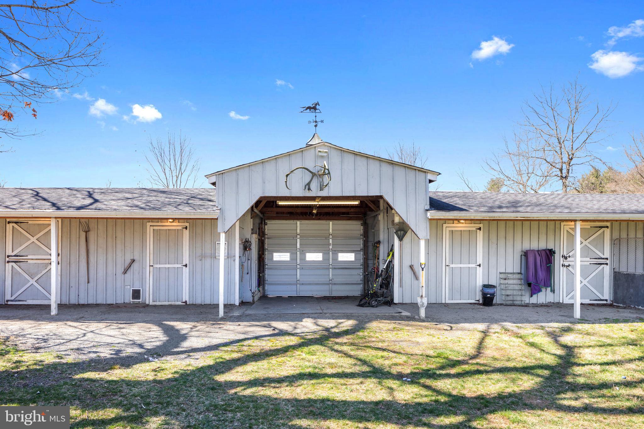 19821 Foggy Bottom Road Bluemont, VA 20135 - Photo 56 of 63 CENTER WASH STALL WITH ROLL UP DOOR