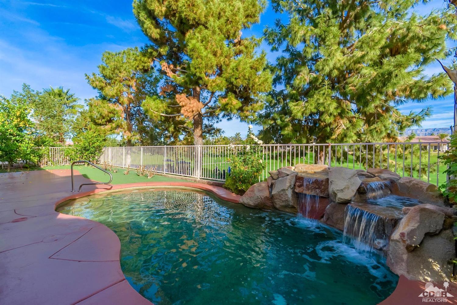 39515 Manorgate Road Palm Desert, CA 92211 - Photo 1 of 42 a backyard of a house with lots of green space