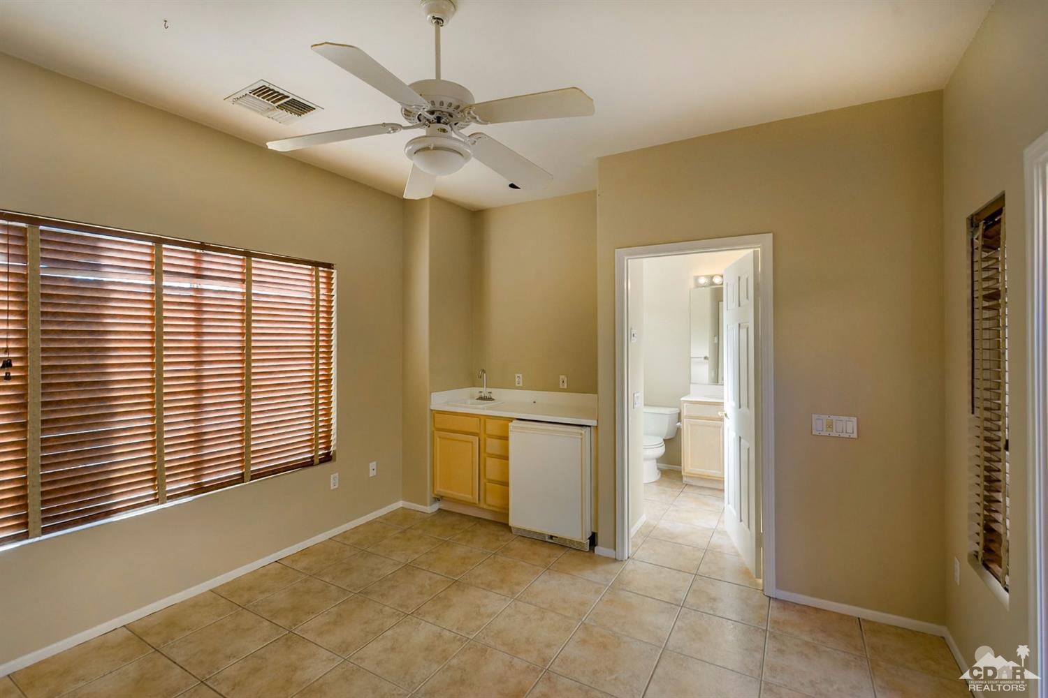 39515 Manorgate Road Palm Desert, CA 92211 - Photo 12 of 42 a view of an empty room with a window
