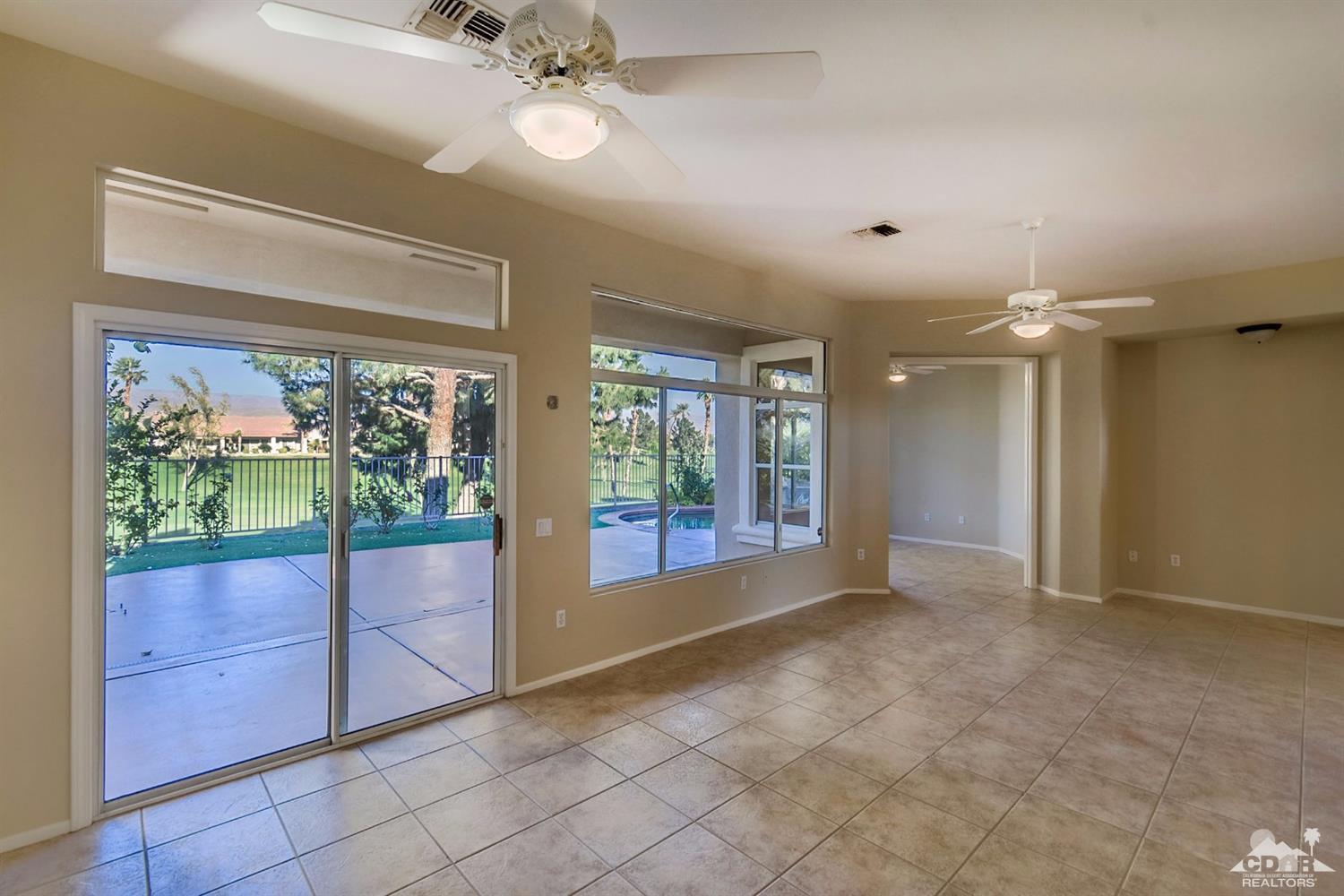 39515 Manorgate Road Palm Desert, CA 92211 - Photo 20 of 42 a view of empty room with floor to ceiling window and ceiling fan