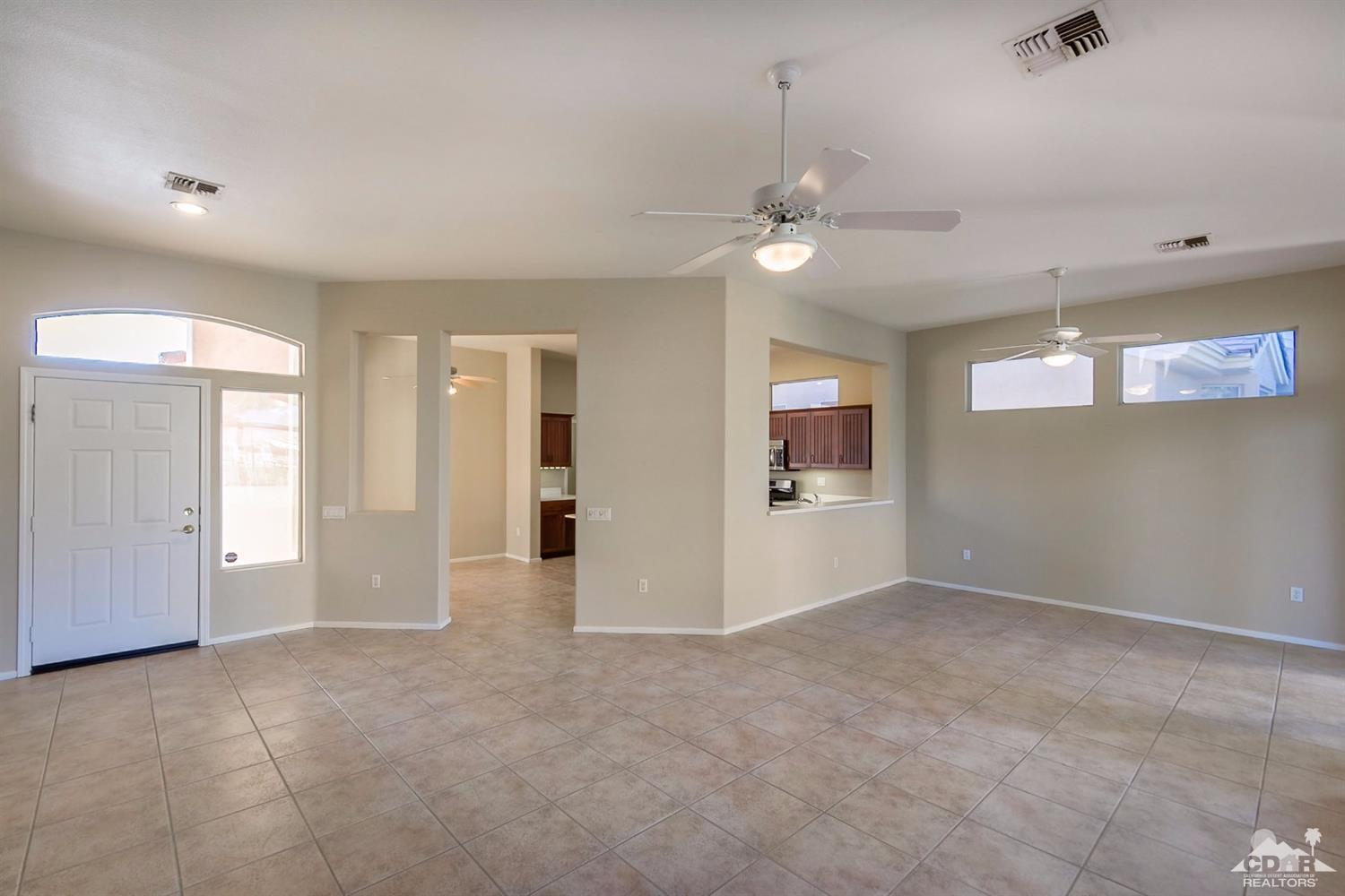 39515 Manorgate Road Palm Desert, CA 92211 - Photo 23 of 42 an empty room with fan and windows