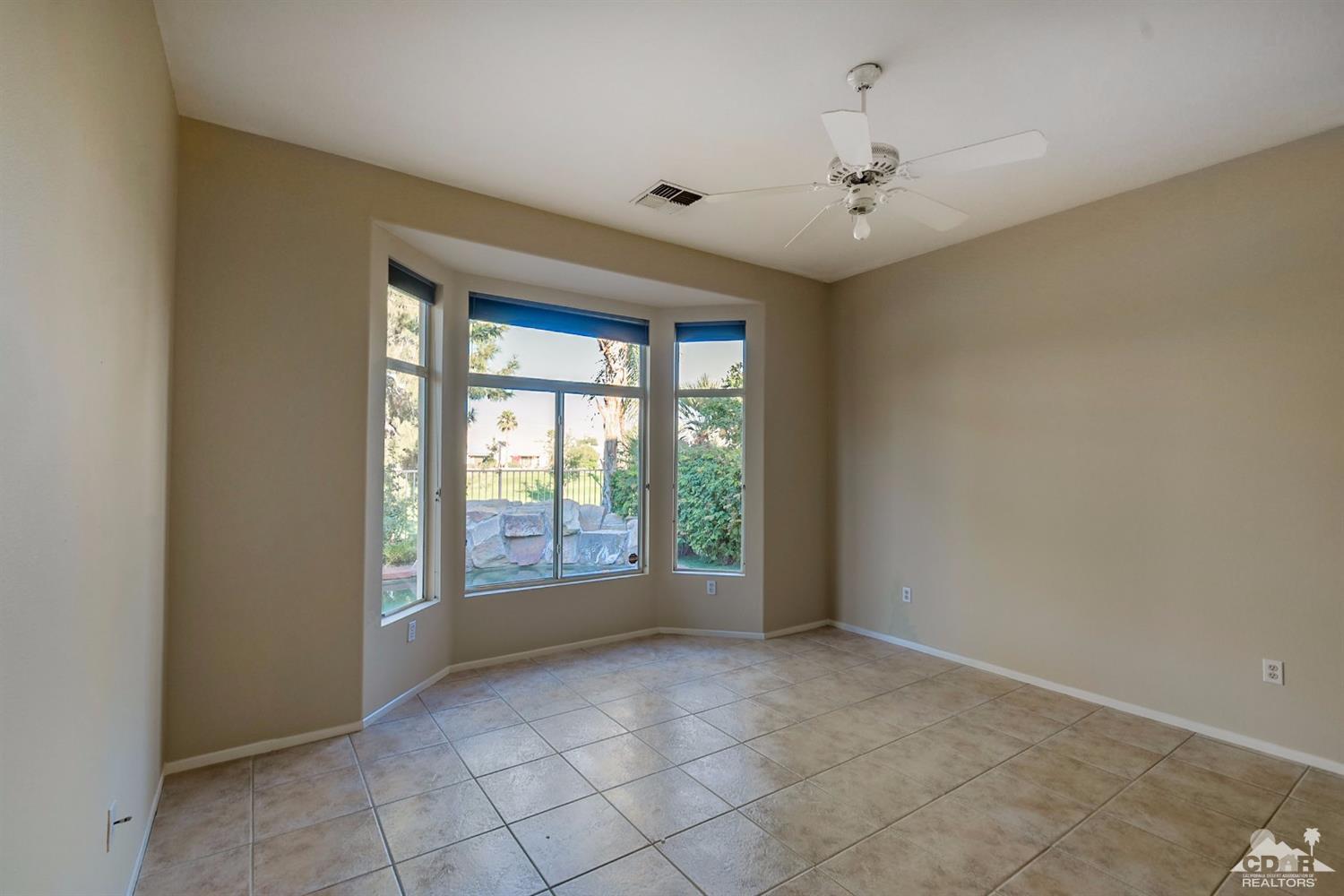 39515 Manorgate Road Palm Desert, CA 92211 - Photo 24 of 42 a view of an empty room with a window