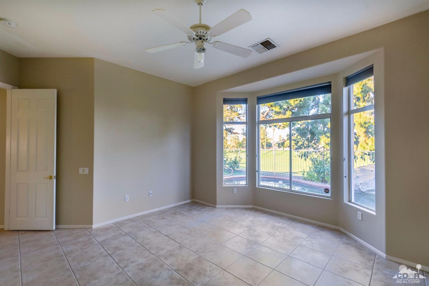 39515 Manorgate Road Palm Desert, CA 92211 - Photo 25 of 42 a view of an empty room with a window