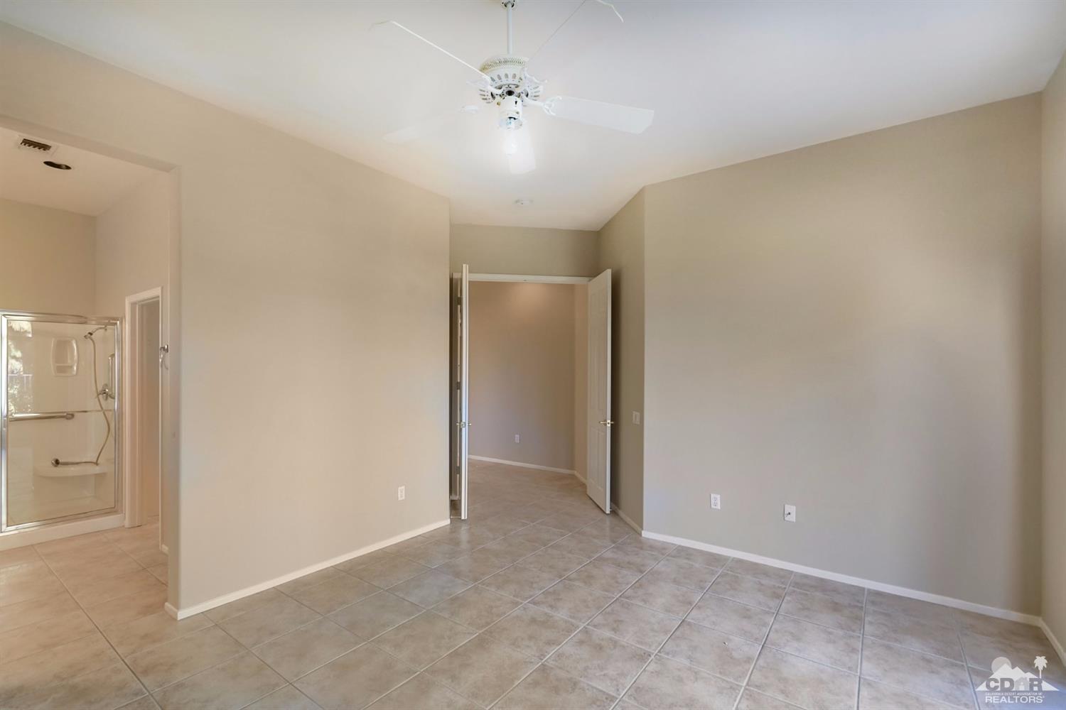 39515 Manorgate Road Palm Desert, CA 92211 - Photo 26 of 42 an empty room with an entryway
