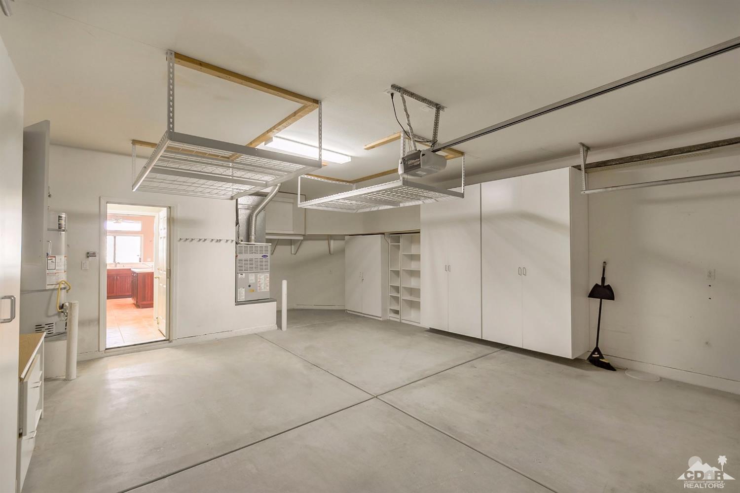 39515 Manorgate Road Palm Desert, CA 92211 - Photo 35 of 42 an empty room with windows