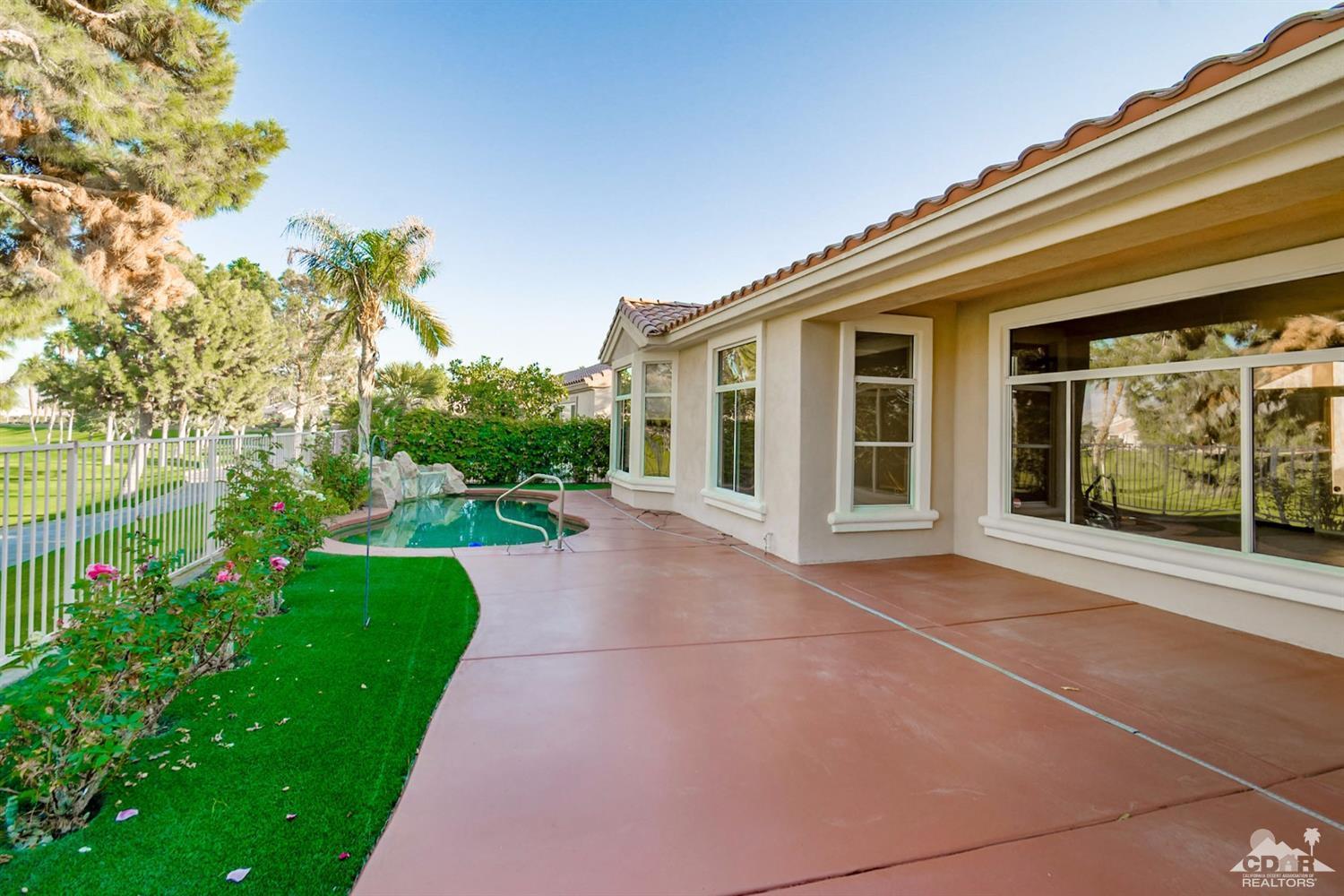 39515 Manorgate Road Palm Desert, CA 92211 - Photo 41 of 42 a view of a house with a backyard