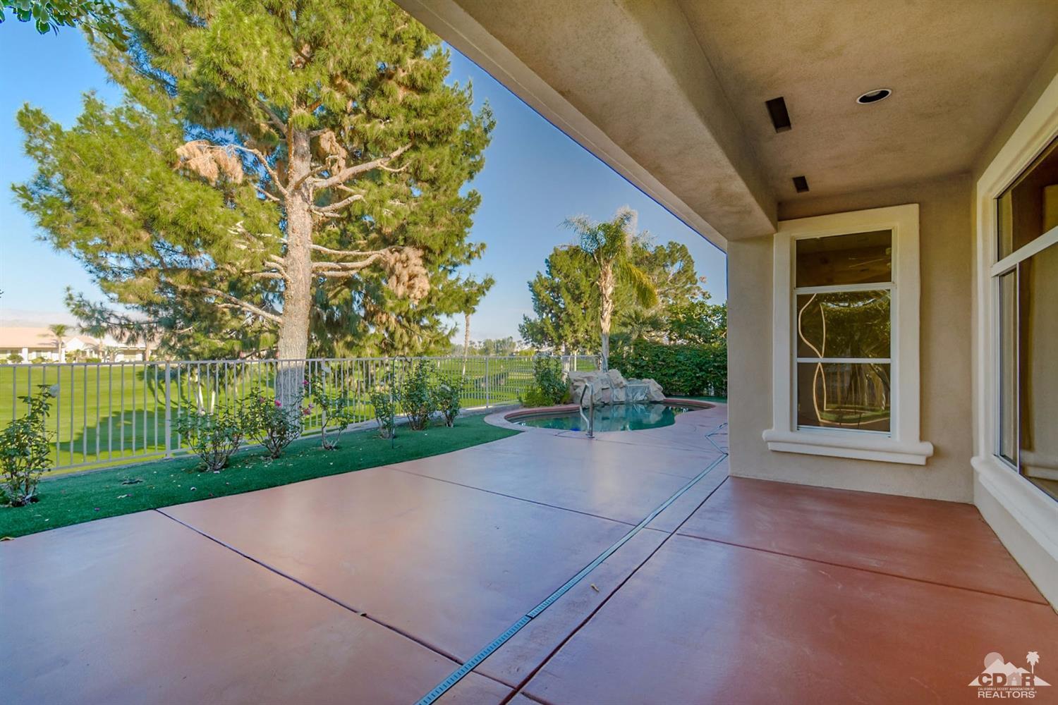 39515 Manorgate Road Palm Desert, CA 92211 - Photo 42 of 42 a view of yellow house with a yard and potted plants