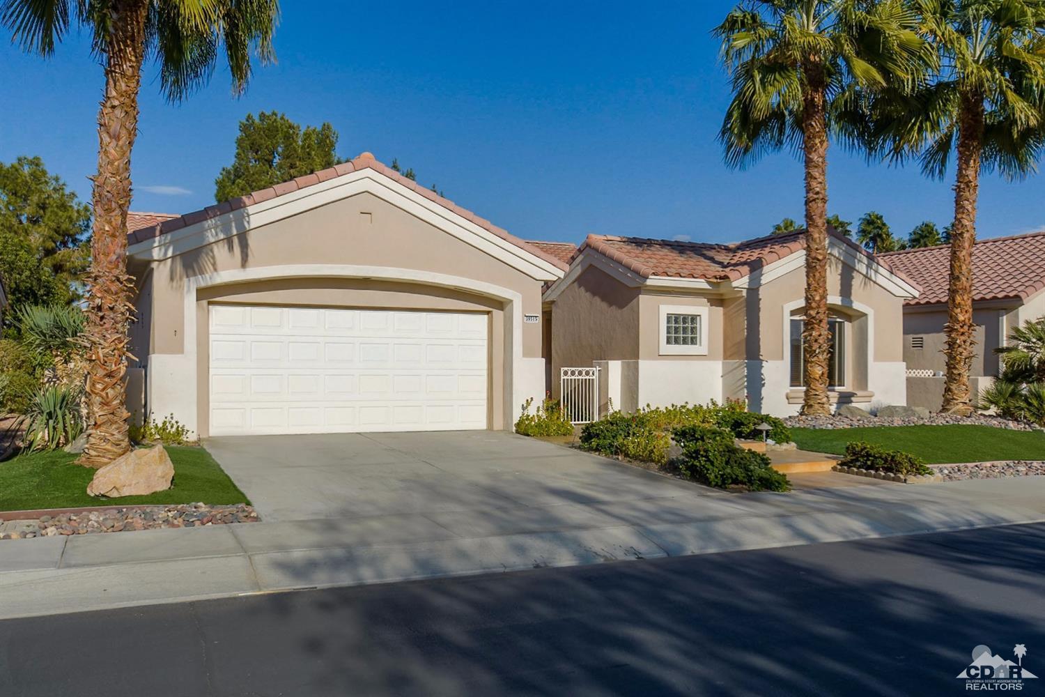 39515 Manorgate Road Palm Desert, CA 92211 - Photo 6 of 42 a front view of a house with a yard and garage