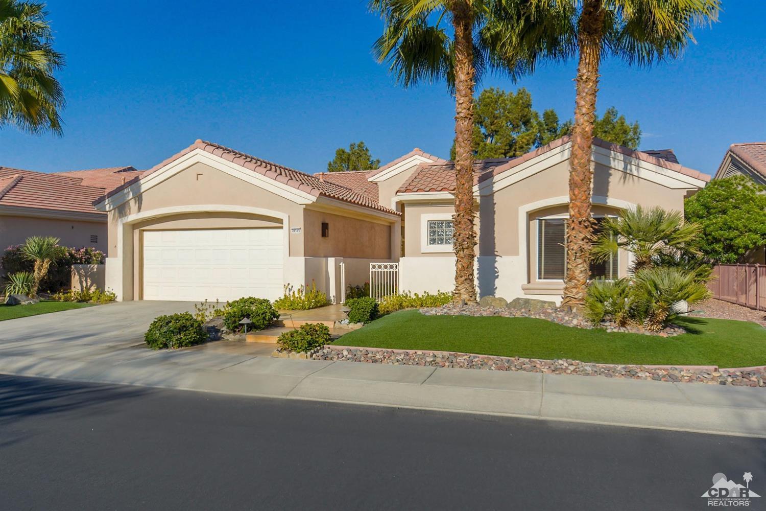 39515 Manorgate Road Palm Desert, CA 92211 - Photo 7 of 42 a front view of a house with a yard and potted plants