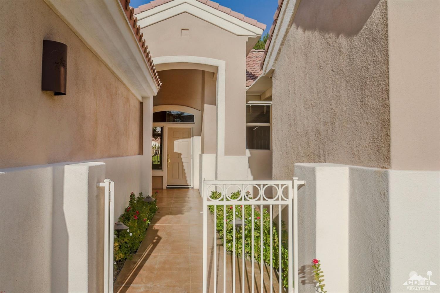 39515 Manorgate Road Palm Desert, CA 92211 - Photo 8 of 42 a front view of a house with garden