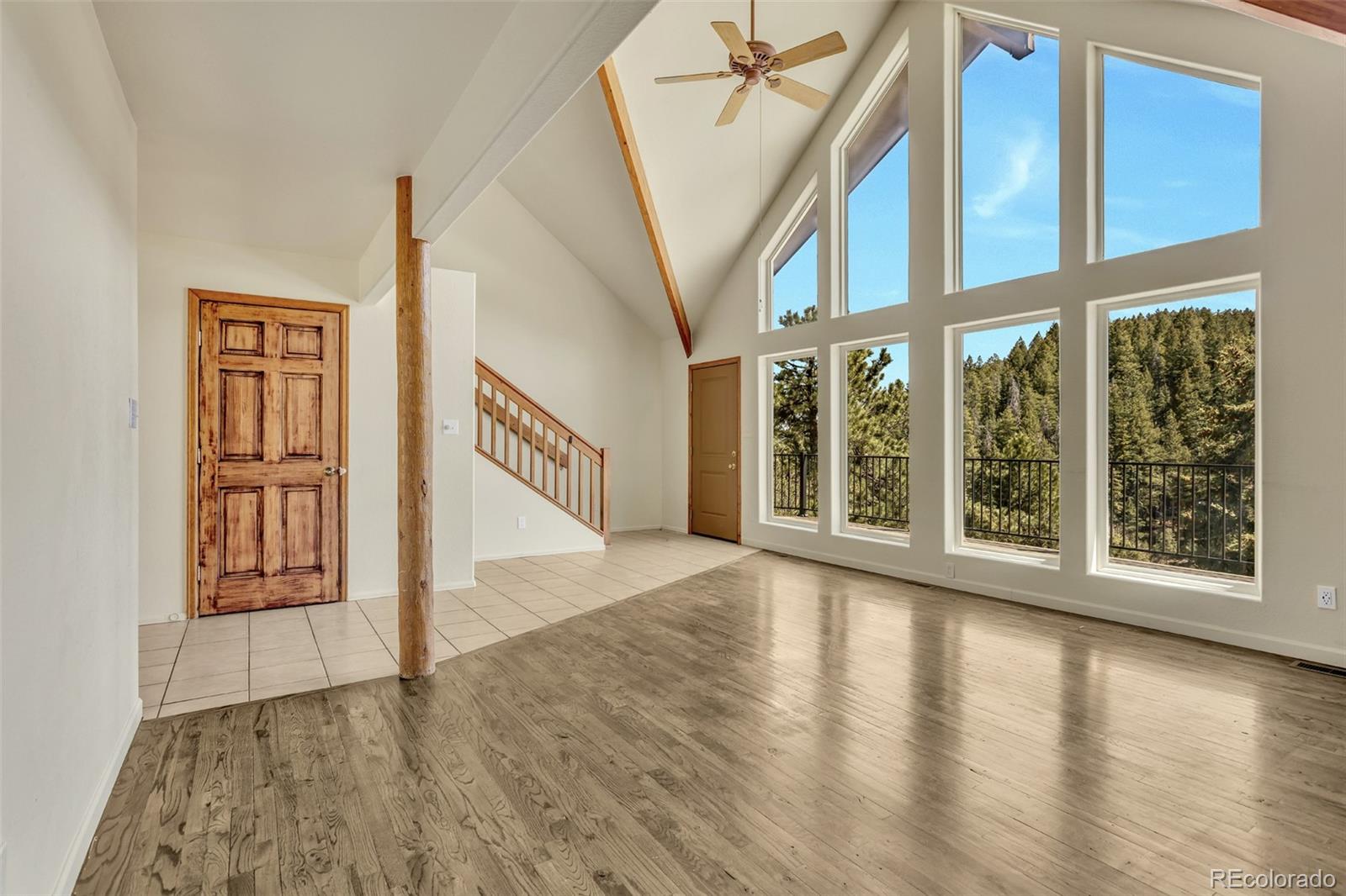 12183 Arnett Ranch Road Littleton, CO 80127 - Photo 6 of 28 a view of an entryway with wooden floor door