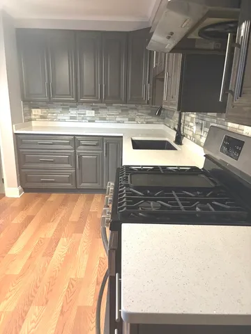 a view of kitchen with wooden floor
