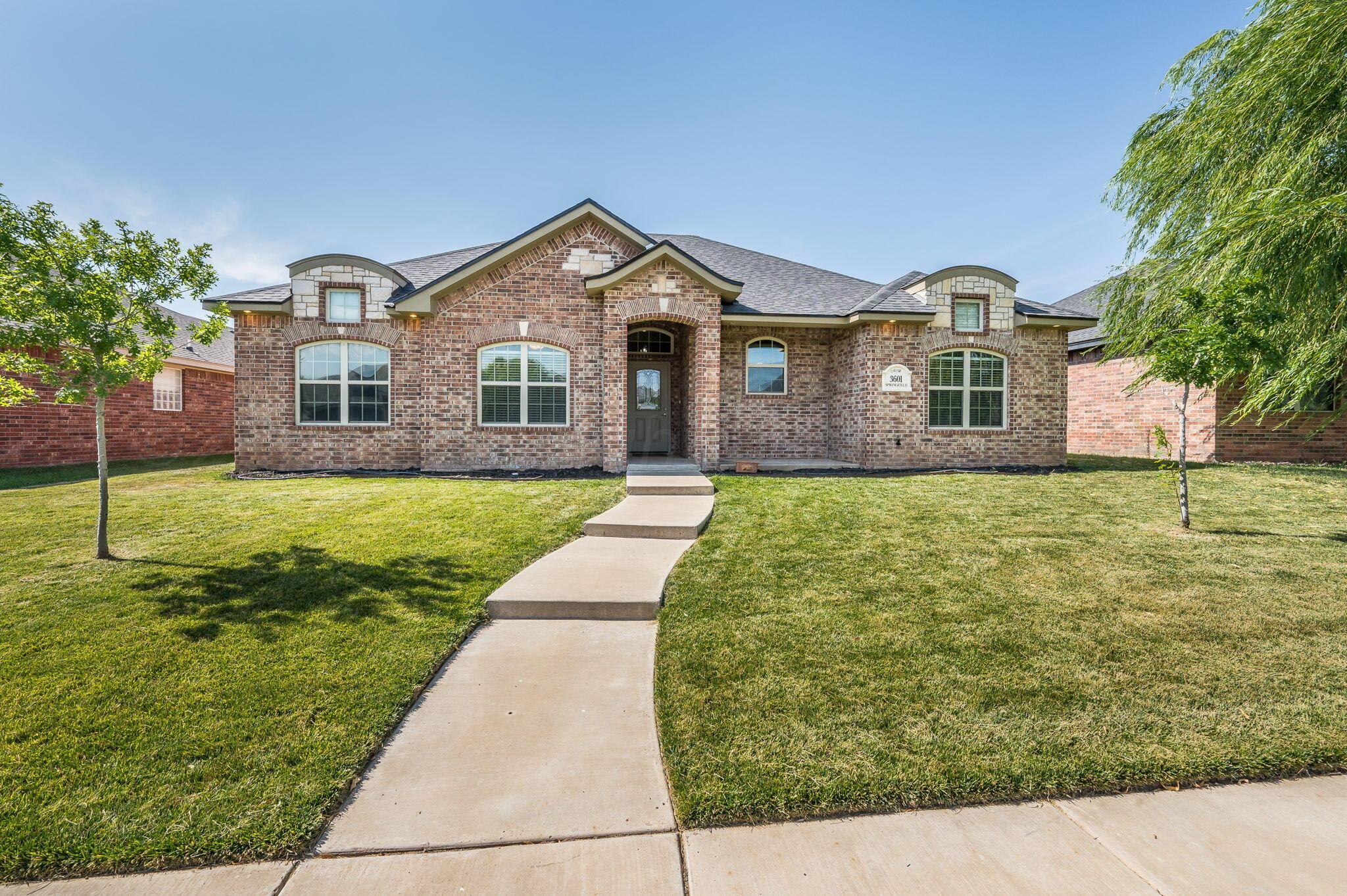 a front view of a house with yard