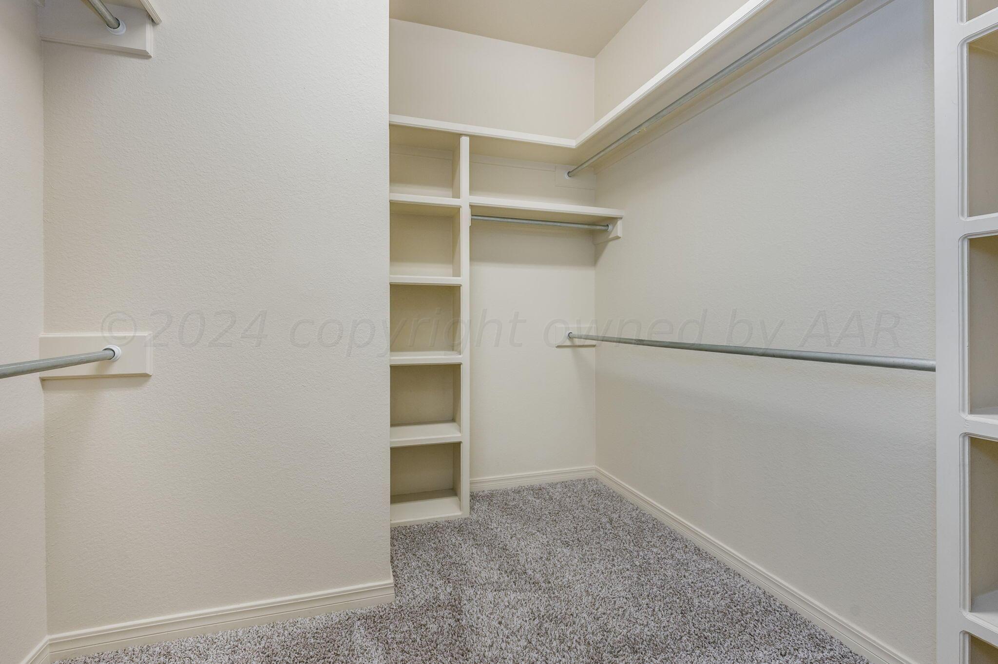 3601 Springfield Avenue Amarillo, TX 79118 - Photo 14 of 26 a view of walk in closet with empty racks