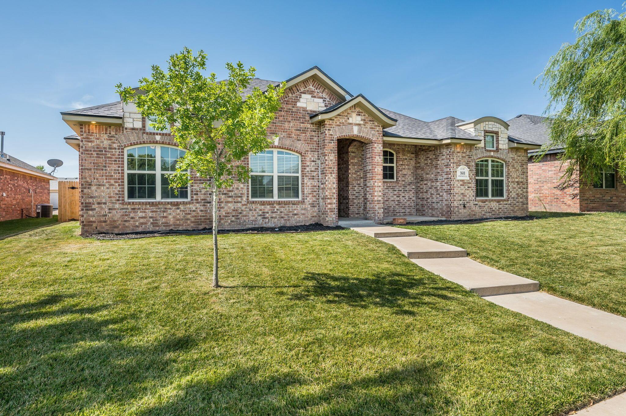 3601 Springfield Avenue Amarillo, TX 79118 - Photo 26 of 26 a front view of a house with a yard and garage