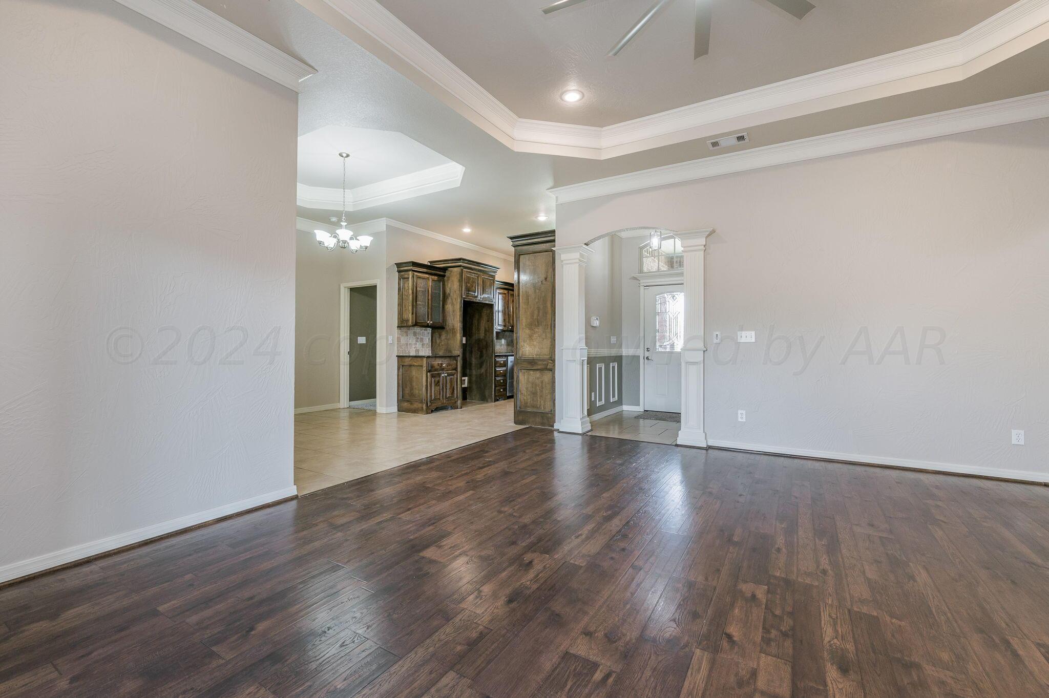 3601 Springfield Avenue Amarillo, TX 79118 - Photo 5 of 26 a view of a hallway with wooden floor