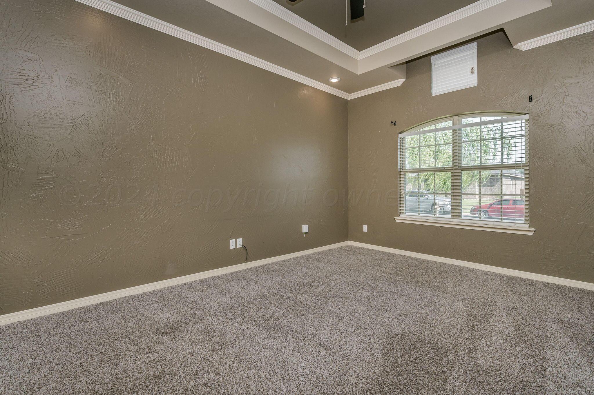 3601 Springfield Avenue Amarillo, TX 79118 - Photo 10 of 26 an empty room with windows and closet