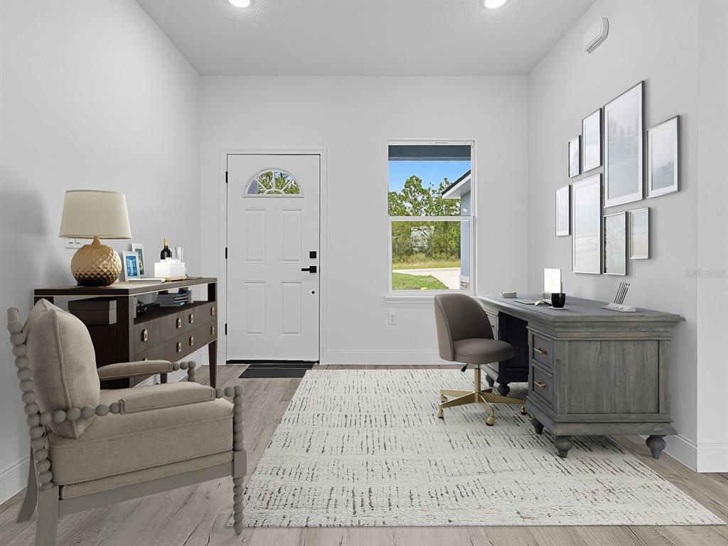 13322 Southwest 85th Circle Ocala, FL 34473 - Photo 8 of 27 a living room with furniture and a window