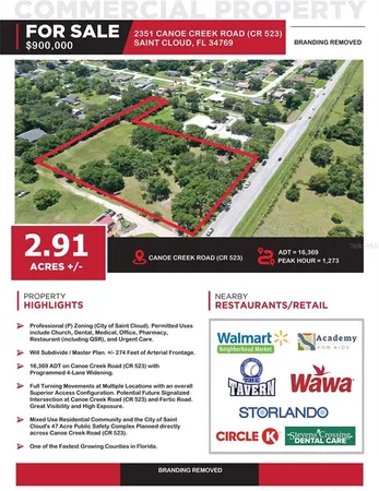 an aerial view of a house with a yard and lake view