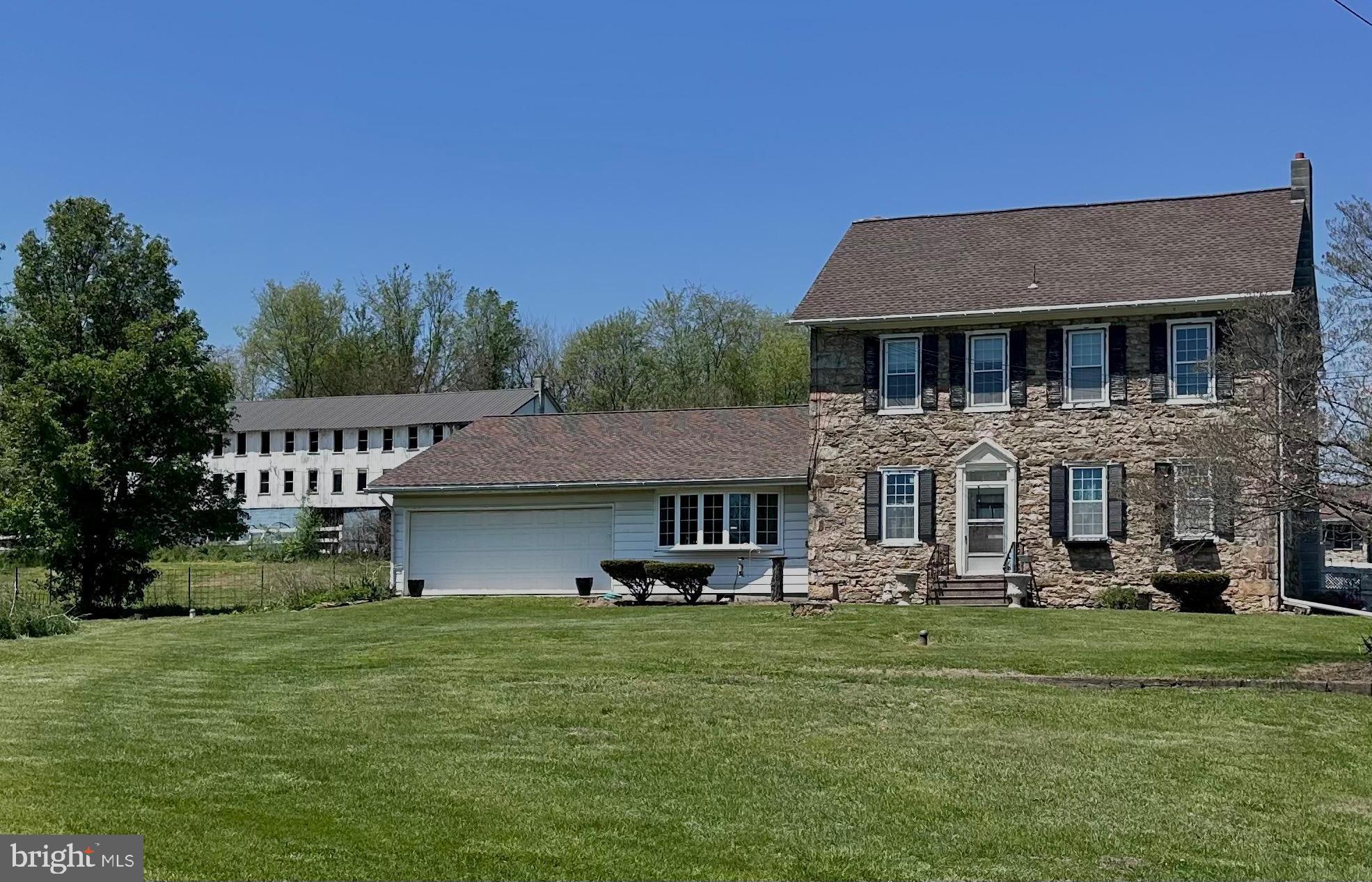 107 Jalappa Road Hamburg, PA 19526 - Photo 1 of 42 a front view of a house with a garden
