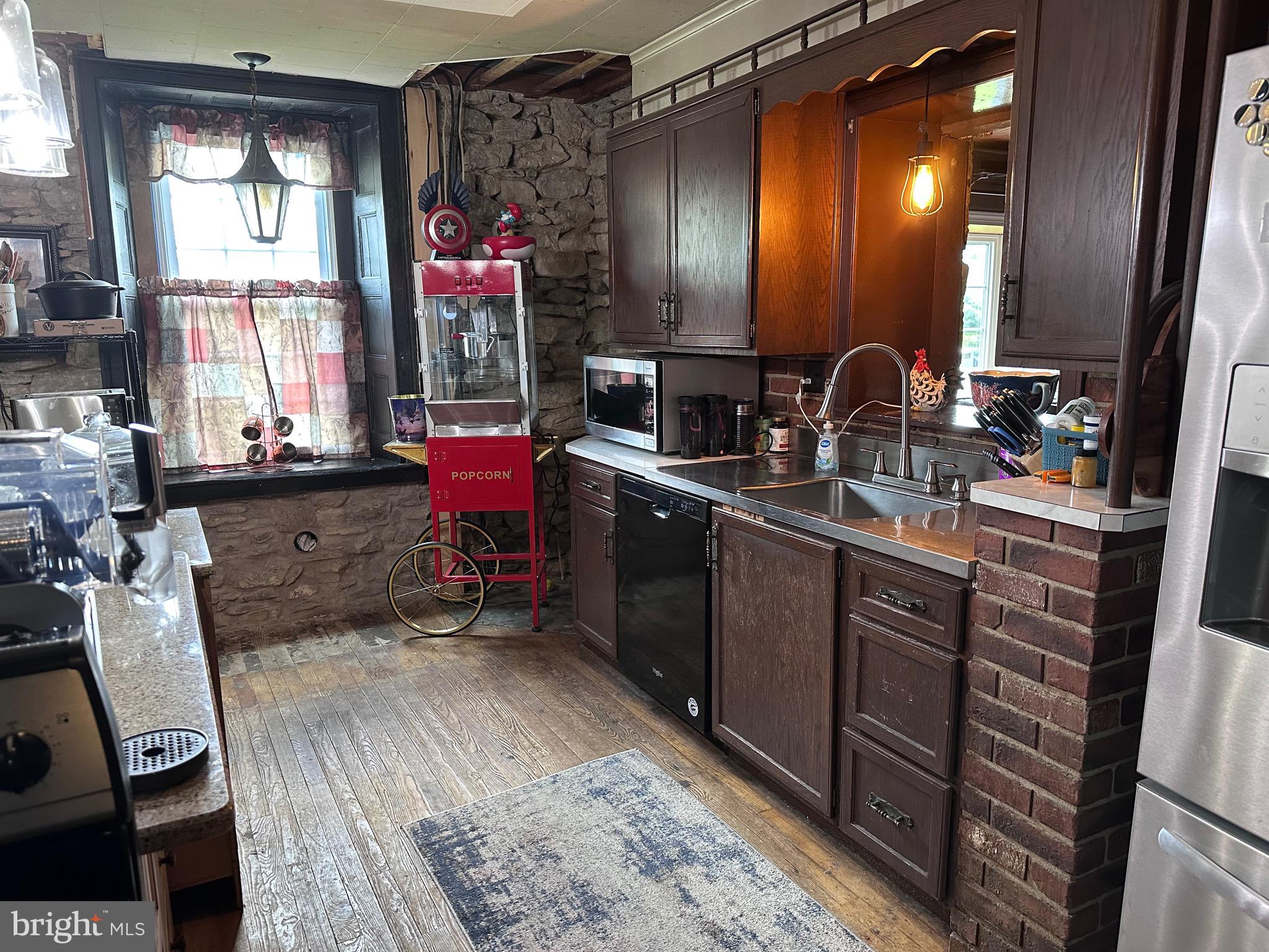 107 Jalappa Road Hamburg, PA 19526 - Photo 17 of 42 a kitchen with sink cabinets and wooden floor