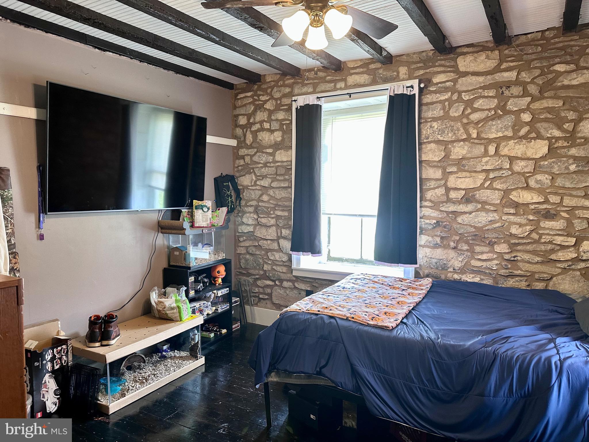 107 Jalappa Road Hamburg, PA 19526 - Photo 27 of 42 a bedroom with a bed and a flat screen tv