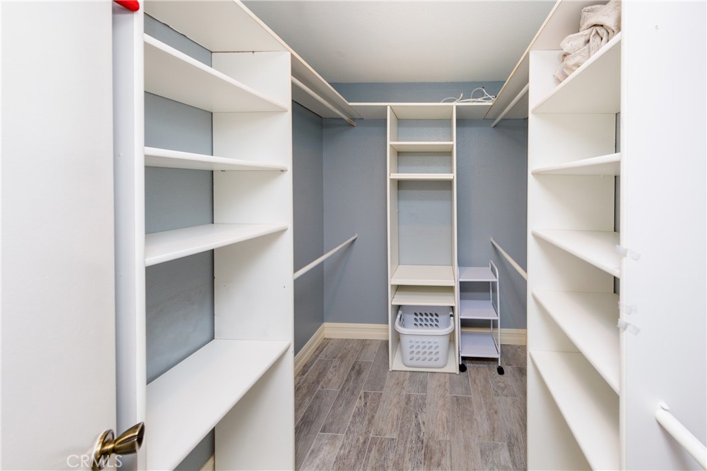 27668 Haskell Canyon Road, Unit H Saugus, CA 91350 - Photo 14 of 18 a view of walk in closet with empty racks