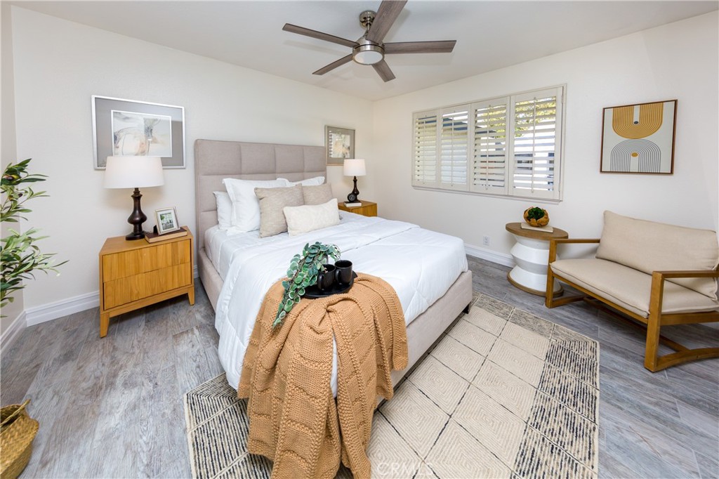 27668 Haskell Canyon Road, Unit H Saugus, CA 91350 - Photo 15 of 18 a spacious bedroom with a bed and a couch