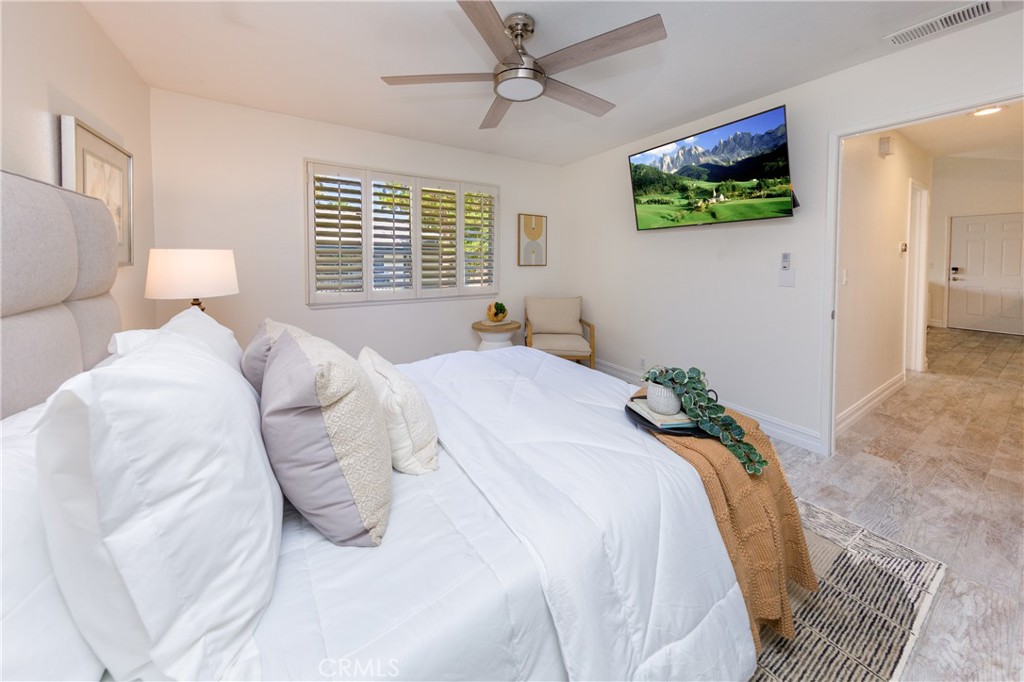 27668 Haskell Canyon Road, Unit H Saugus, CA 91350 - Photo 16 of 18 a bed sitting in a bedroom and flat screen tv